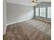 Spacious bedroom with carpeted floor and three windows at 1664 Bridwell Ln, Mount Pleasant, SC 29466