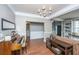 Open living room with hardwood floors, a brown couch, and a built-in bookcase at 168 Pavilion St, Summerville, SC 29483