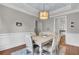 Elegant dining room with a light gray wall and white wainscoting at 1779 Tennyson Row # 5, Mount Pleasant, SC 29466