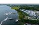 Aerial view of waterfront community with marina, dock, and residential buildings at 1809 Beekman St, Daniel Island, SC 29492