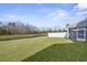 Large backyard with pond view and screened porch at 187 Weeping Cypress Dr, Moncks Corner, SC 29461