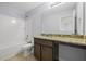 Bathroom with tub, toilet and granite countertop at 187 Weeping Cypress Dr, Moncks Corner, SC 29461