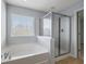 Bathroom featuring garden tub and separate shower at 187 Weeping Cypress Dr, Moncks Corner, SC 29461