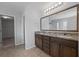 Bathroom with double vanity, granite countertop, and large mirror at 187 Weeping Cypress Dr, Moncks Corner, SC 29461