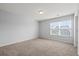 Bright bedroom featuring a large window and carpet at 187 Weeping Cypress Dr, Moncks Corner, SC 29461