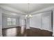 Formal dining room with hardwood floors and neutral wall colors at 187 Weeping Cypress Dr, Moncks Corner, SC 29461