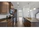 Modern kitchen with granite countertops and stainless steel appliances at 187 Weeping Cypress Dr, Moncks Corner, SC 29461
