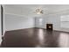 Large living room with hardwood floors, fireplace, and ceiling fan at 187 Weeping Cypress Dr, Moncks Corner, SC 29461