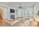 Virtually staged living room featuring comfortable seating and a fireplace at 1915 Hall Point Rd, Mount Pleasant, SC 29466