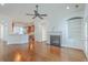 Open living room and kitchen with hardwood floors and a fireplace at 1915 Hall Point Rd, Mount Pleasant, SC 29466