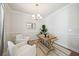 Bright dining room with wood table and white chairs at 203 Alma Square Dr, Moncks Corner, SC 29461