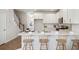 Open concept kitchen with island seating and hardwood floors at 203 Abercom Place Dr, Moncks Corner, SC 29461