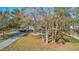 Aerial view of property, showcasing landscaping and driveway at 208 Catfish Landing Cir, Bonneau, SC 29431