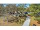 Aerial view showing home, yard, and boat storage at 208 Catfish Landing Cir, Bonneau, SC 29431