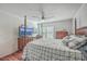Bedroom with wood floors, a ceiling fan, and a large TV at 208 Catfish Landing Cir, Bonneau, SC 29431