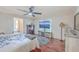 Bedroom with wood floors, a ceiling fan, and a large TV at 208 Catfish Landing Cir, Bonneau, SC 29431
