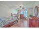 Bedroom with wood floors, ceiling fan and antique furniture at 208 Catfish Landing Cir, Bonneau, SC 29431