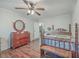 Bedroom with wood floors, ceiling fan and antique furniture at 208 Catfish Landing Cir, Bonneau, SC 29431
