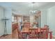 Dining area with kitchen island and hardwood floors at 208 Catfish Landing Cir, Bonneau, SC 29431