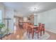 Open concept dining area and kitchen with hardwood floors at 208 Catfish Landing Cir, Bonneau, SC 29431