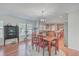 Bright dining area with wood table and chairs, kitchen views at 208 Catfish Landing Cir, Bonneau, SC 29431