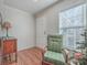 Bright entryway with wood floors, green chair, and antique side table at 208 Catfish Landing Cir, Bonneau, SC 29431