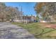 Exterior view of mobile home with pool and landscaping at 208 Catfish Landing Cir, Bonneau, SC 29431