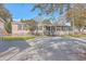 Tan mobile home exterior with screened porch at 208 Catfish Landing Cir, Bonneau, SC 29431