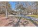 Landscaped yard with a long driveway and covered boat storage at 208 Catfish Landing Cir, Bonneau, SC 29431