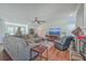 Spacious living room with a fireplace, sectional sofa, and large TV at 208 Catfish Landing Cir, Bonneau, SC 29431