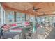 Relaxing screened porch with wicker furniture and ceiling fan at 208 Catfish Landing Cir, Bonneau, SC 29431
