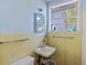 Small bathroom with a single sink, toilet, and light blue walls at 2108 Ridge Church Rd # A & B, Summerville, SC 29486