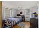 Bedroom with double bed, wood floors, and two windows at 2108 Ridge Church Rd # A & B, Summerville, SC 29486