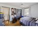 Bedroom with double bed, wood floors, and built-in shelves at 2108 Ridge Church Rd # A & B, Summerville, SC 29486