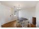 Small dining area with a round table and four chairs, hardwood floors at 2108 Ridge Church Rd # A & B, Summerville, SC 29486