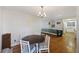 Bright dining room with a round table and four chairs, kitchen view at 2108 Ridge Church Rd # A & B, Summerville, SC 29486