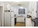 Efficient kitchen with white cabinets, a gas stove, and refrigerator at 2108 Ridge Church Rd # A & B, Summerville, SC 29486