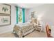 Charming bedroom with teal curtains and patterned bedding at 211 Wild Strawberry Ln, Moncks Corner, SC 29461