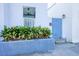 Blue gate and planter lead to the front entrance at 25 Sheppard St, Charleston, SC 29403