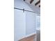Interior view featuring a white barn door and exposed beams at 25 Sheppard St, Charleston, SC 29403