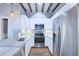 Modern kitchen with white cabinets, stainless steel appliances, and granite counters at 25 Sheppard St, Charleston, SC 29403