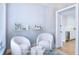 Virtually staged sitting area with two armchairs and a small table at 25 Sheppard St, Charleston, SC 29403