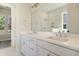 Double vanity bathroom with marble tile and a shower at 2841 Auldreeke Rd, Johns Island, SC 29455