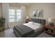 Spacious bedroom with gray bedding and wood nightstands at 2841 Auldreeke Rd, Johns Island, SC 29455