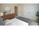 Bedroom with gray bedding and double doors to closet at 2841 Auldreeke Rd, Johns Island, SC 29455