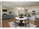 Open concept dining area with round table and kitchen view at 2841 Auldreeke Rd, Johns Island, SC 29455