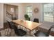 Elegant dining room with wood table and black chairs at 2841 Auldreeke Rd, Johns Island, SC 29455