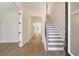 Bright entry with wood-look floors and view to the kitchen at 2841 Auldreeke Rd, Johns Island, SC 29455