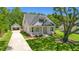 Craftsman style home with front porch, detached garage, and mature landscaping at 2841 Auldreeke Rd, Johns Island, SC 29455