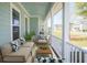 Relaxing front porch with outdoor seating and neighborhood views at 2841 Auldreeke Rd, Johns Island, SC 29455